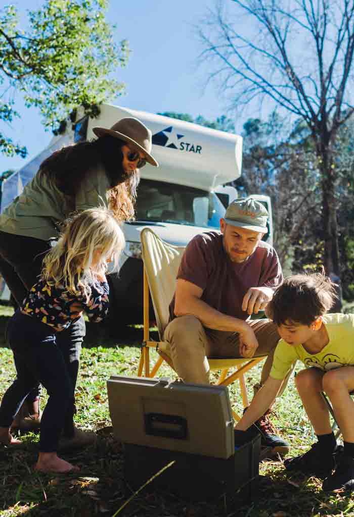 Family looking in fishing tackle box