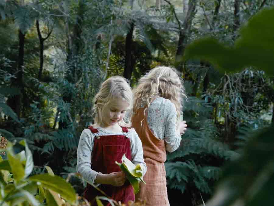 Young girls picking plants